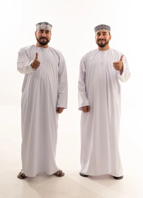 Omani Men in Traditional Dishdasha Thumbs Up