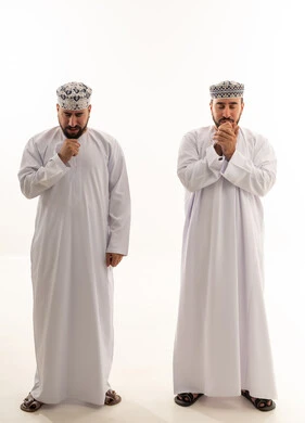 Omani Men in Traditional Dishdasha on White Background