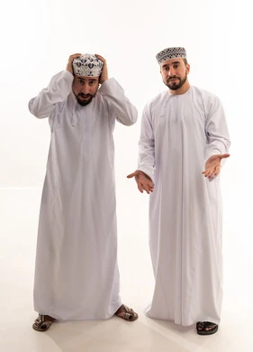 Omani Men in Traditional Dress Expressing Confusion