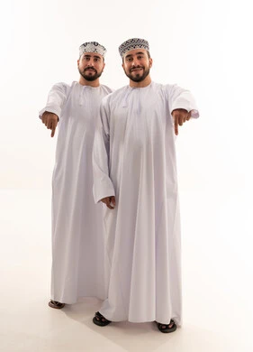 Two Omani Men in Traditional Dress Pointing Down