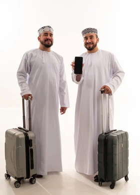 Omani Men with Travel Suitcases and Smartphone