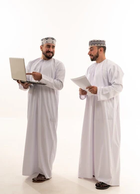 Omani Men with Laptop and Documents in Studio