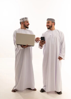 Omani Men Using Laptop and Smartphone on White Background