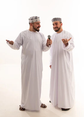 Two Omani Men in Traditional Dress with Microphone