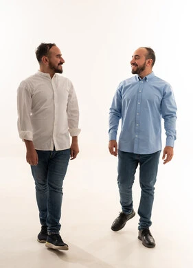 Saudi Men Walking Together in Studio on White Background