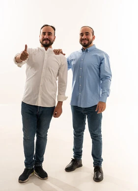Two Saudi Men Smiling with Thumbs Up in Studio