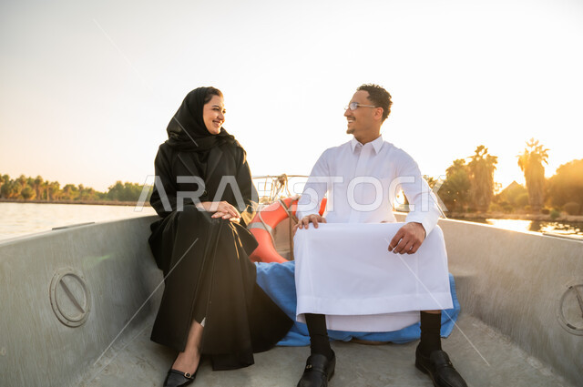 Saudi Couple on Boat Trip at Sunset Golden Hour