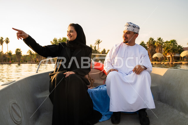 Omani Couple on Boat Trip at Sunset