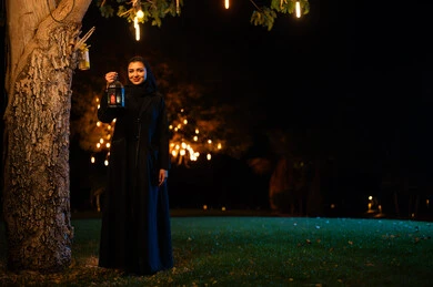 Arab Woman Holding Traditional Lantern at Night