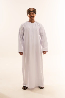 Omani Man in Traditional White Dishdasha and Mussar
