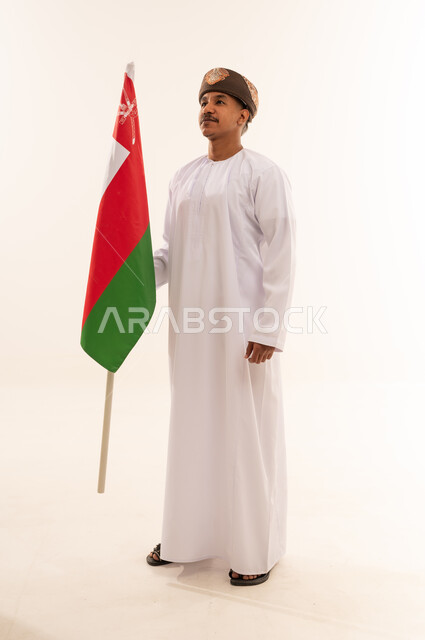Omani Man Holding National Flag on White Background