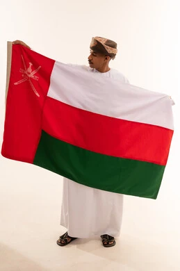 Omani Man Holding National Flag of Oman