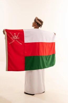 Omani Boy Holding National Flag on White Background