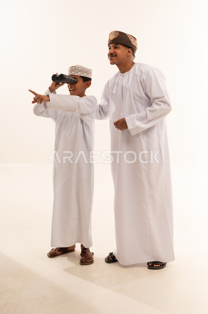 Omani Man and Boy with Binoculars in Studio