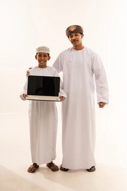 Omani Man and Boy Holding Laptop on White Background