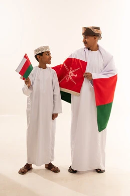 Omani Man and Boy with National Flag in Studio