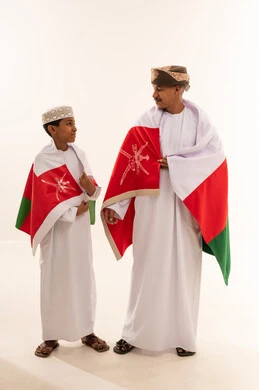 Omani Man and Boy with National Flag in Studio