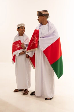 Omani Man and Boy with National Flag in Studio