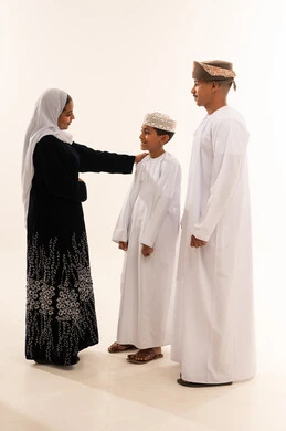 Omani Family in Traditional Dress on White Background