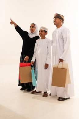 Omani Family with Shopping Bags on White Background