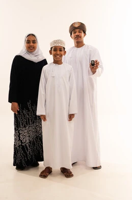 Omani Family in Traditional Clothing Holding Car Key