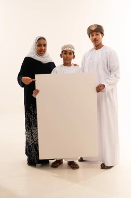 Omani Family Holding Blank White Board in Studio