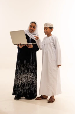 Omani Woman and Boy with Laptop on White Background
