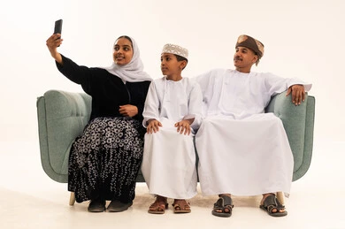 Omani Family Taking Selfie in Traditional Dress
