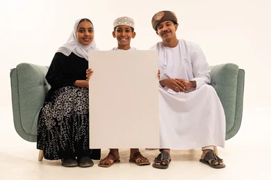 Omani Family Holding Blank White Board in Studio