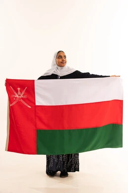 Omani Woman Holding National Flag of Oman