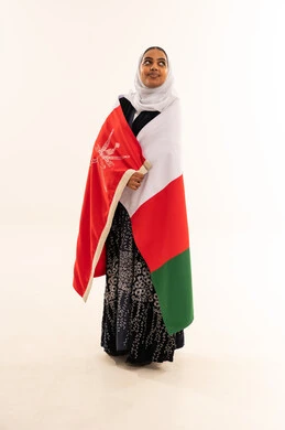 Omani Woman Wrapped in Oman Flag on White Background