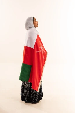 Omani Woman Wrapped in Oman National Flag Profile View