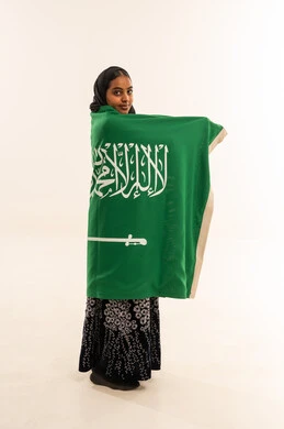 Saudi Woman Holding National Flag on White Background
