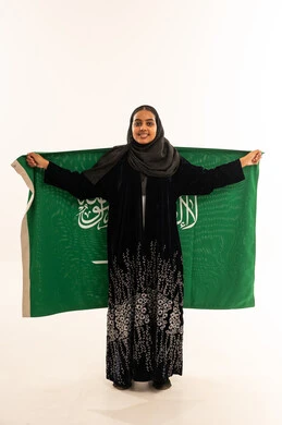 Saudi Woman Holding National Flag on White Background