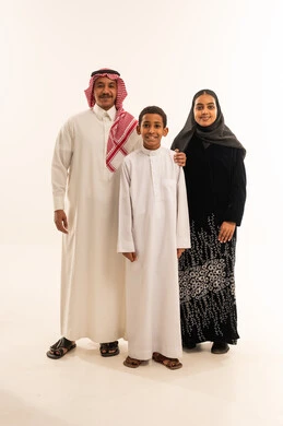 Saudi Family in Traditional Clothing on White Background