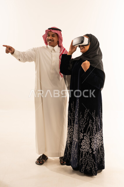 Saudi Man and Woman Using VR Headset in Studio