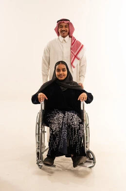 Saudi Couple with Woman in Wheelchair Studio Portrait