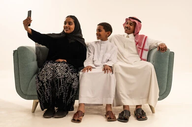 Saudi Family Taking Selfie in Traditional Clothing