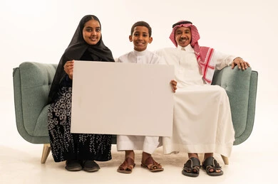 Saudi Family Holding Blank White Board in Studio