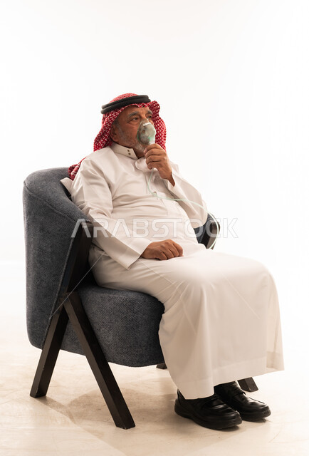 Elderly Saudi Man Using Oxygen Mask in Studio
