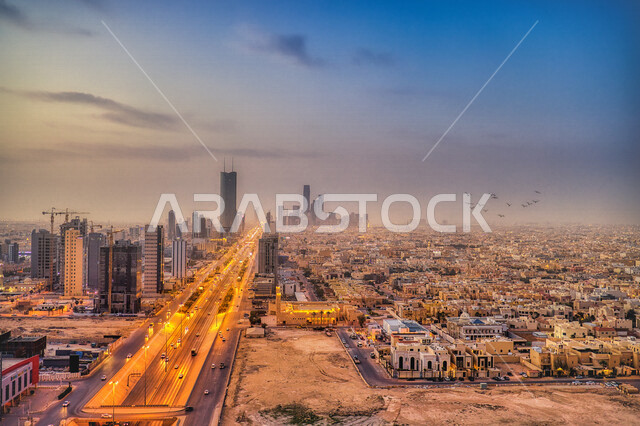 صورة ابداعية لشروق وغروب الشمس في مدينة الرياض بالمملكة العربية السعودية، شروق وغروب الشمس، الفن الهندسي المعماري في السعودية، الابراج وناطحات السحاب، معالم الرياض المشهورة، السياحة في السعودية