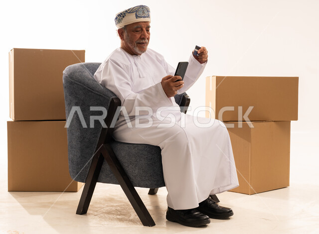 Omani Senior Shopping Online with Credit Card
