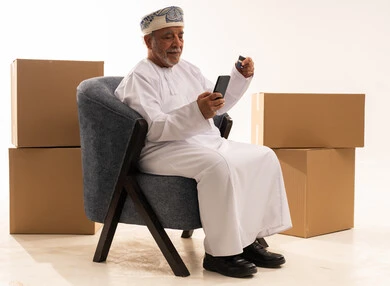 Omani Senior Shopping Online with Credit Card