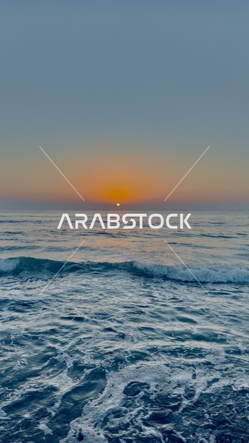 Sunset over Ocean Waves in Sultanate of Oman