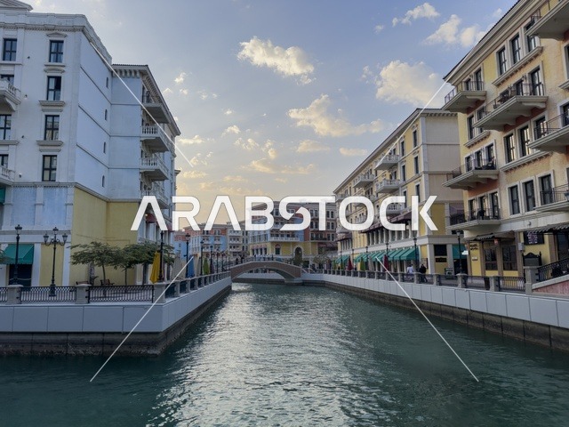 Qanat Quartier canal at The Pearl in Doha showcasing luxury buildings and beautiful reflections on the water. doha.Qatar - February 15 2026 .