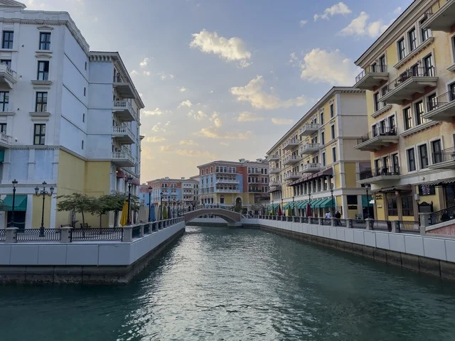 Qanat Quartier canal at The Pearl in Doha showcasing luxury buildings and beautiful reflections on the water. doha.Qatar - February 15 2026 .