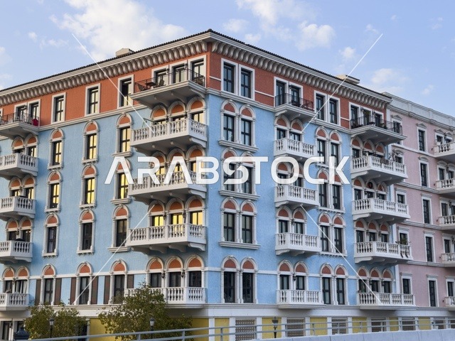 Qanat Quartier canal at The Pearl in Doha showcasing luxury buildings and beautiful reflections on the water. doha.Qatar - February 15 2026 .