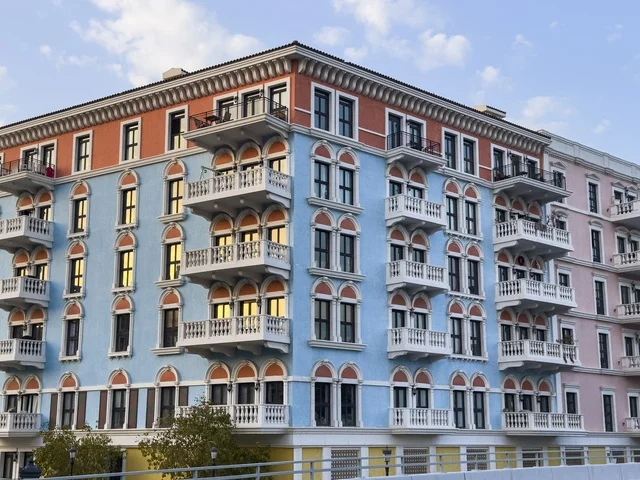 Qanat Quartier canal at The Pearl in Doha showcasing luxury buildings and beautiful reflections on the water. doha.Qatar - February 15 2026 .