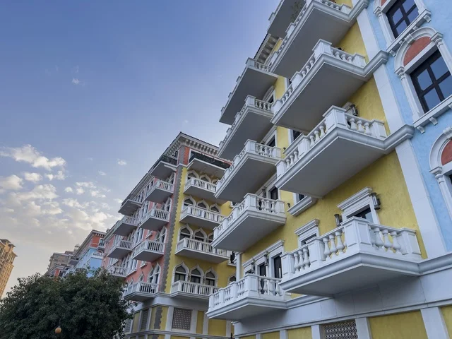 Qanat Quartier canal at The Pearl in Doha showcasing luxury buildings and beautiful reflections on the water. doha.Qatar - February 15 2026 .