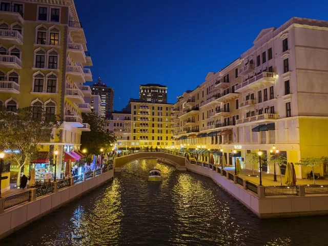 Qanat Quartier canal at The Pearl in Doha showcasing luxury buildings and beautiful reflections on the water. doha.Qatar - February 15 2026 .